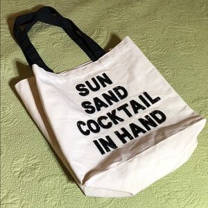 sun sand cocktail in hand